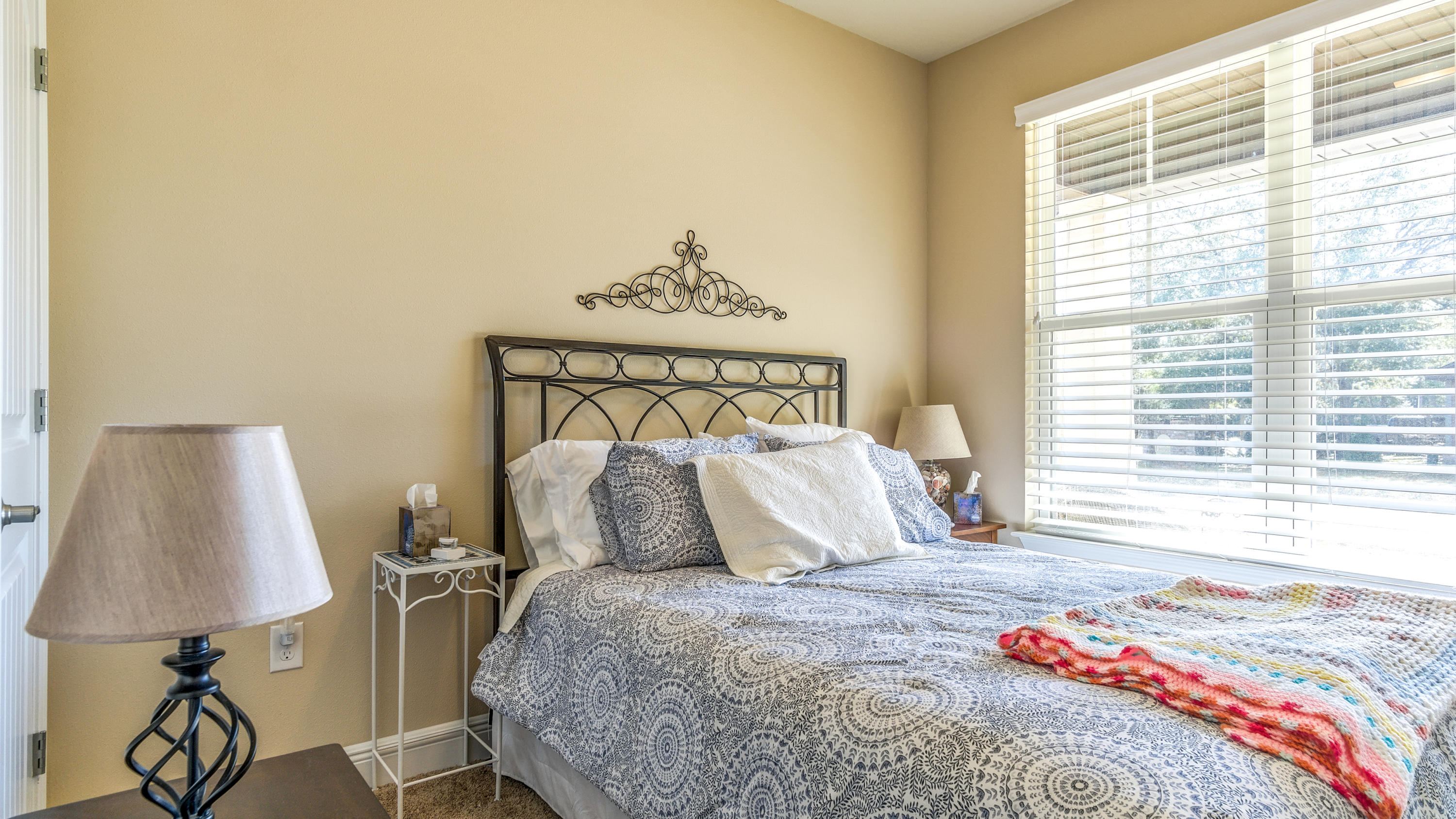 12 Benton Boulevard Freeport, FL 32439 - Photo 13 of 28 a bedroom with a bed and a lamp