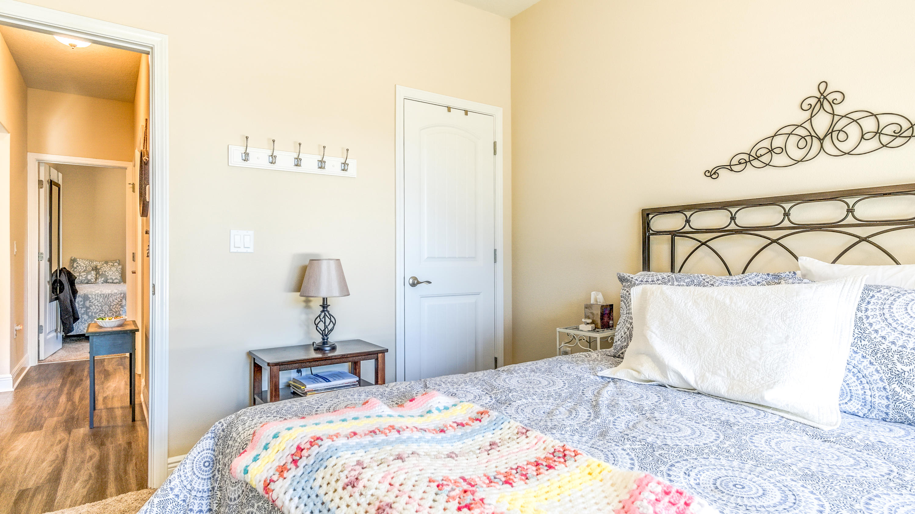 12 Benton Boulevard Freeport, FL 32439 - Photo 18 of 28 a bedroom with a bed and a lamp with table