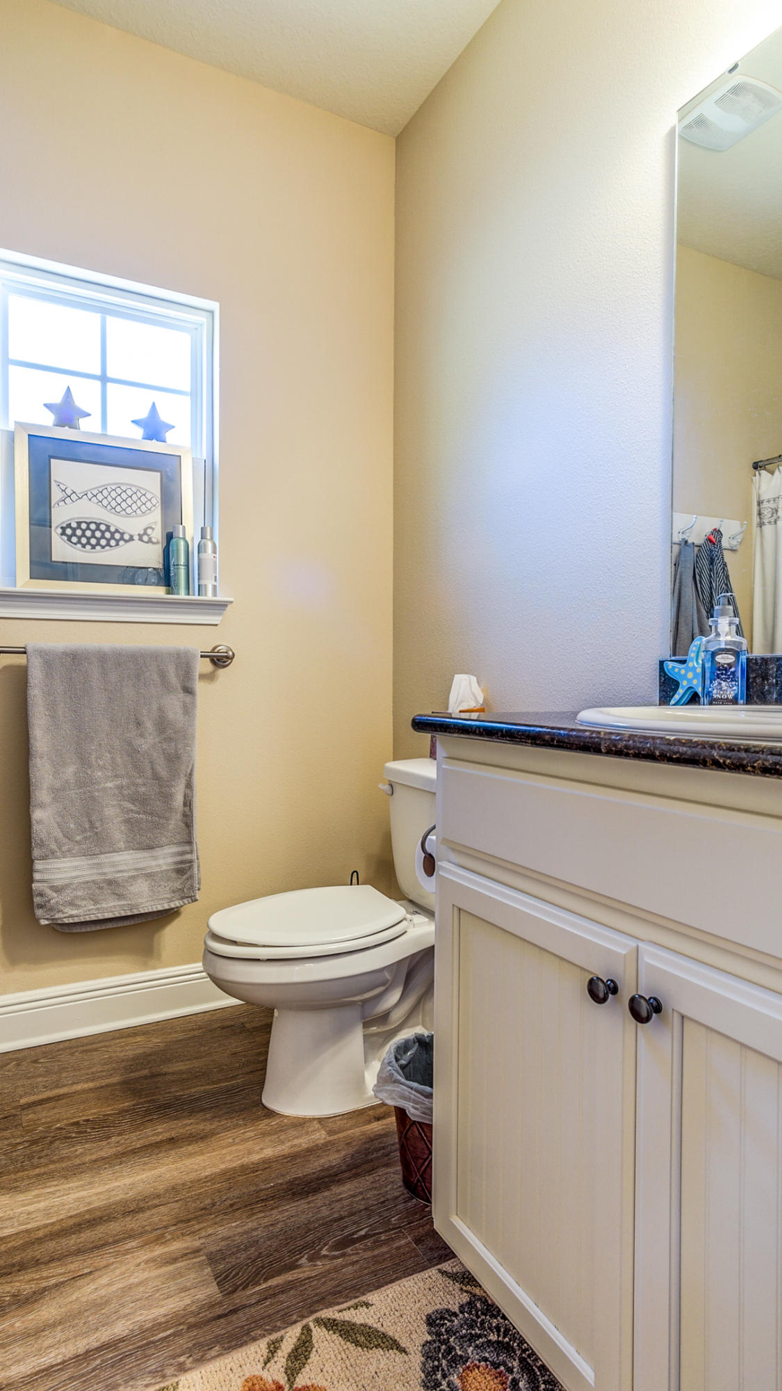 12 Benton Boulevard Freeport, FL 32439 - Photo 19 of 28 a bathroom with a toilet and a mirror