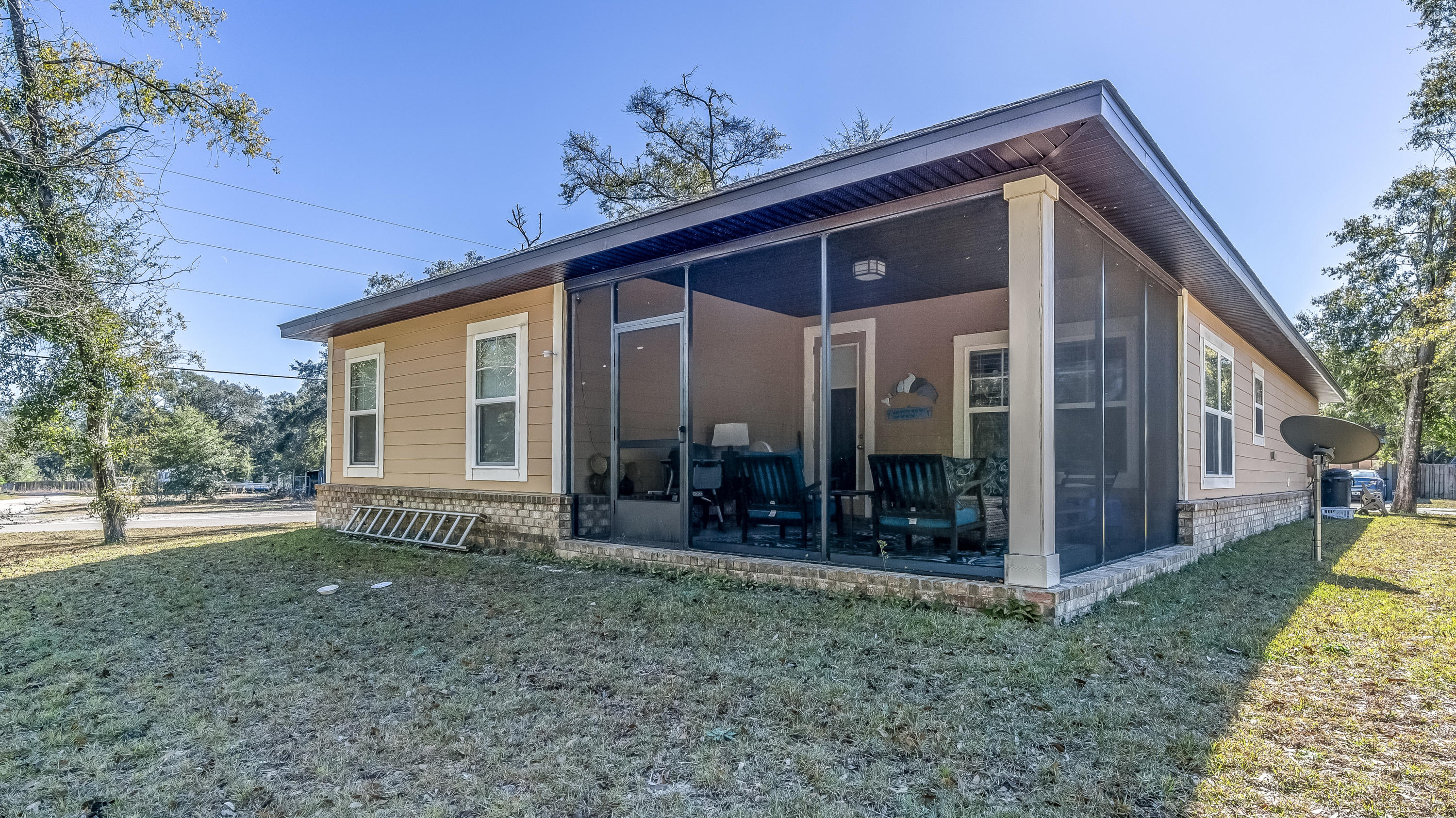 12 Benton Boulevard Freeport, FL 32439 - Photo 22 of 28 a front view of a house with garden