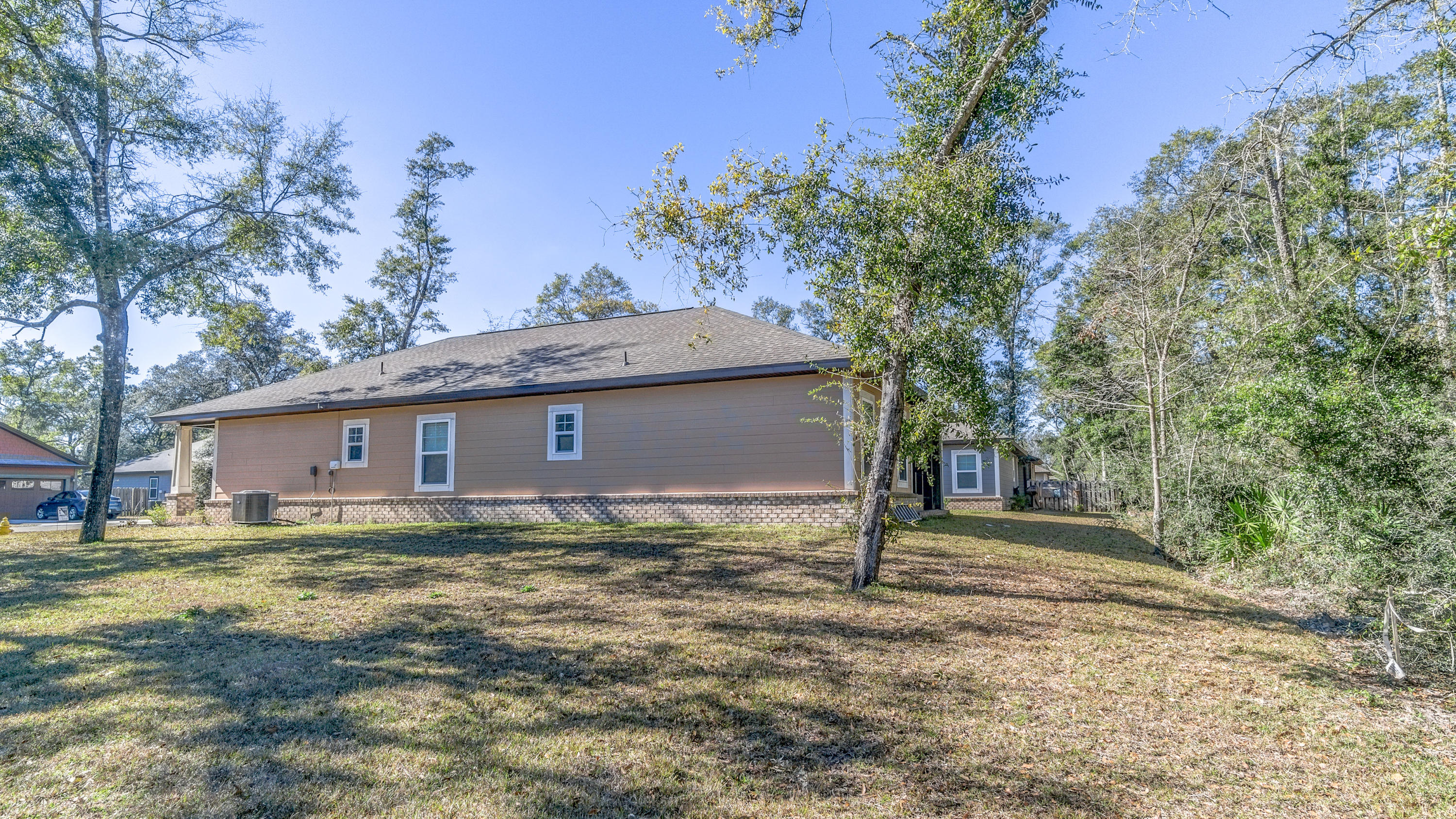 12 Benton Boulevard Freeport, FL 32439 - Photo 25 of 28 a house that has a tree in front of it