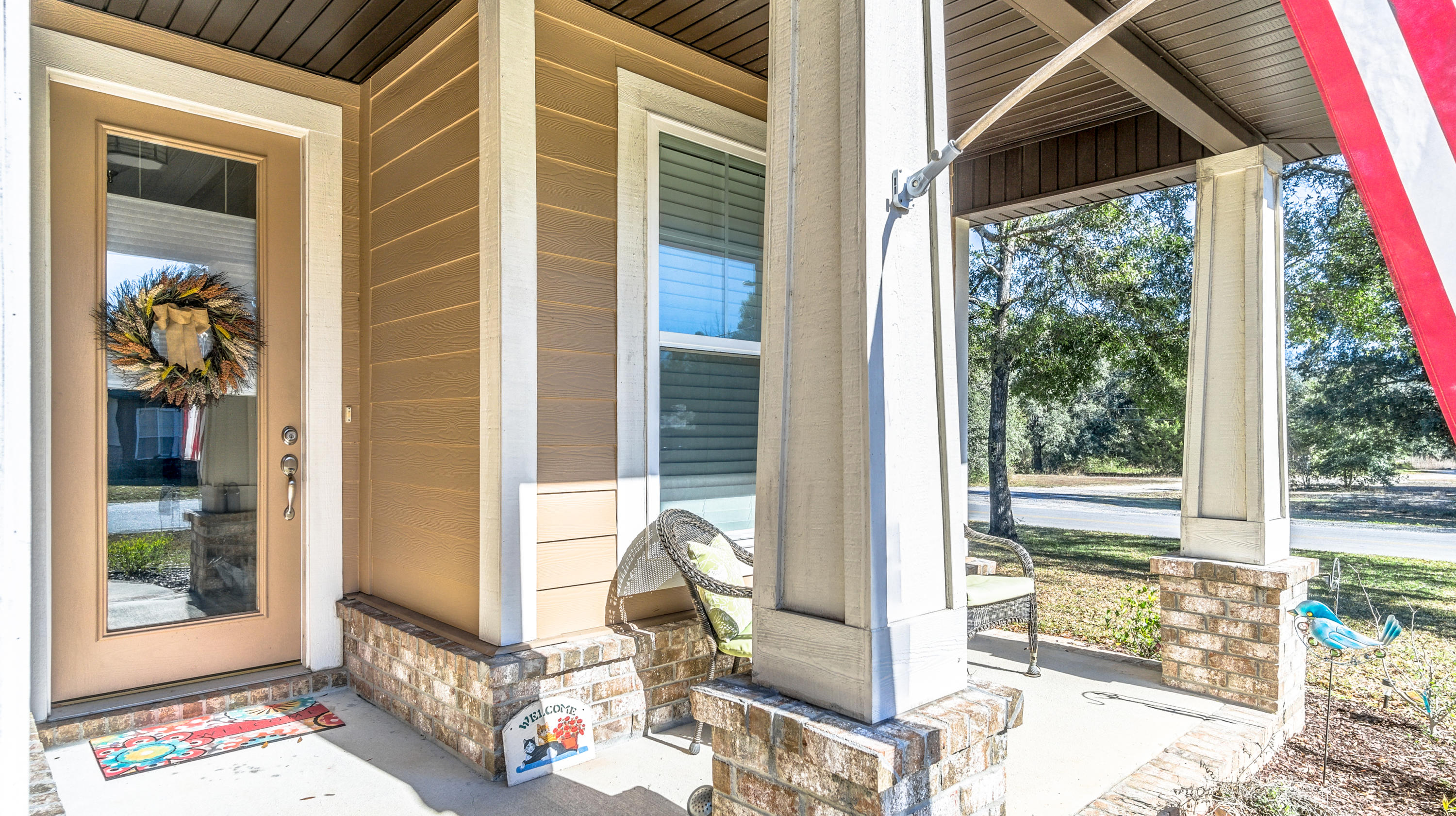 12 Benton Boulevard Freeport, FL 32439 - Photo 27 of 28 a front view of a house with wooden floor and a porch