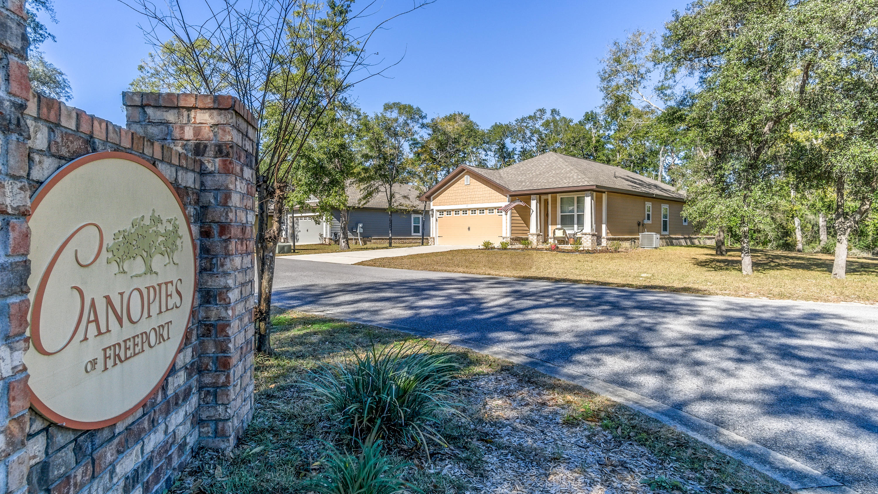 12 Benton Boulevard Freeport, FL 32439 - Photo 28 of 28 a front view of a house with garden