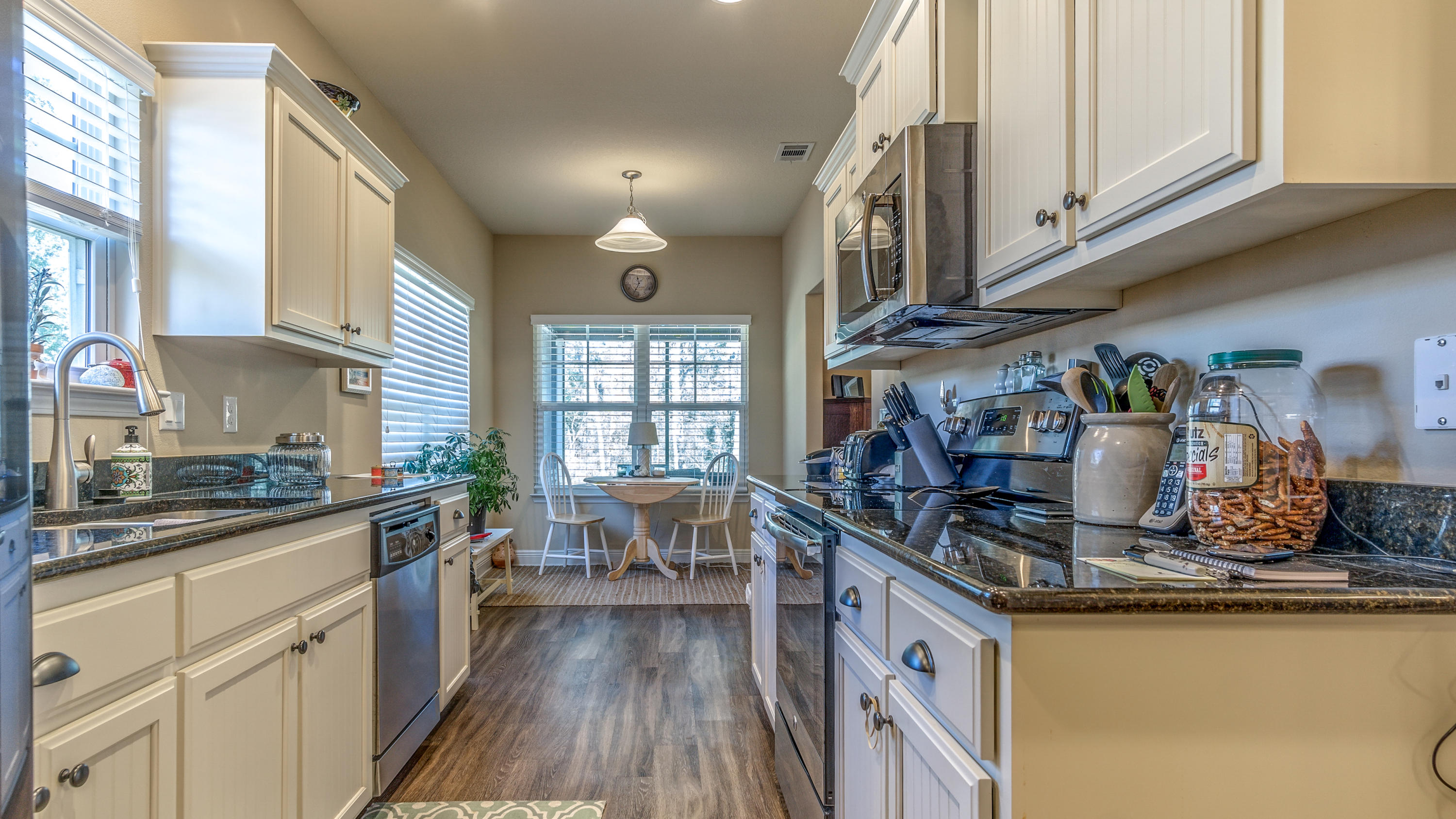 12 Benton Boulevard Freeport, FL 32439 - Photo 5 of 28 a kitchen with stainless steel appliances granite countertop a sink stove and cabinets
