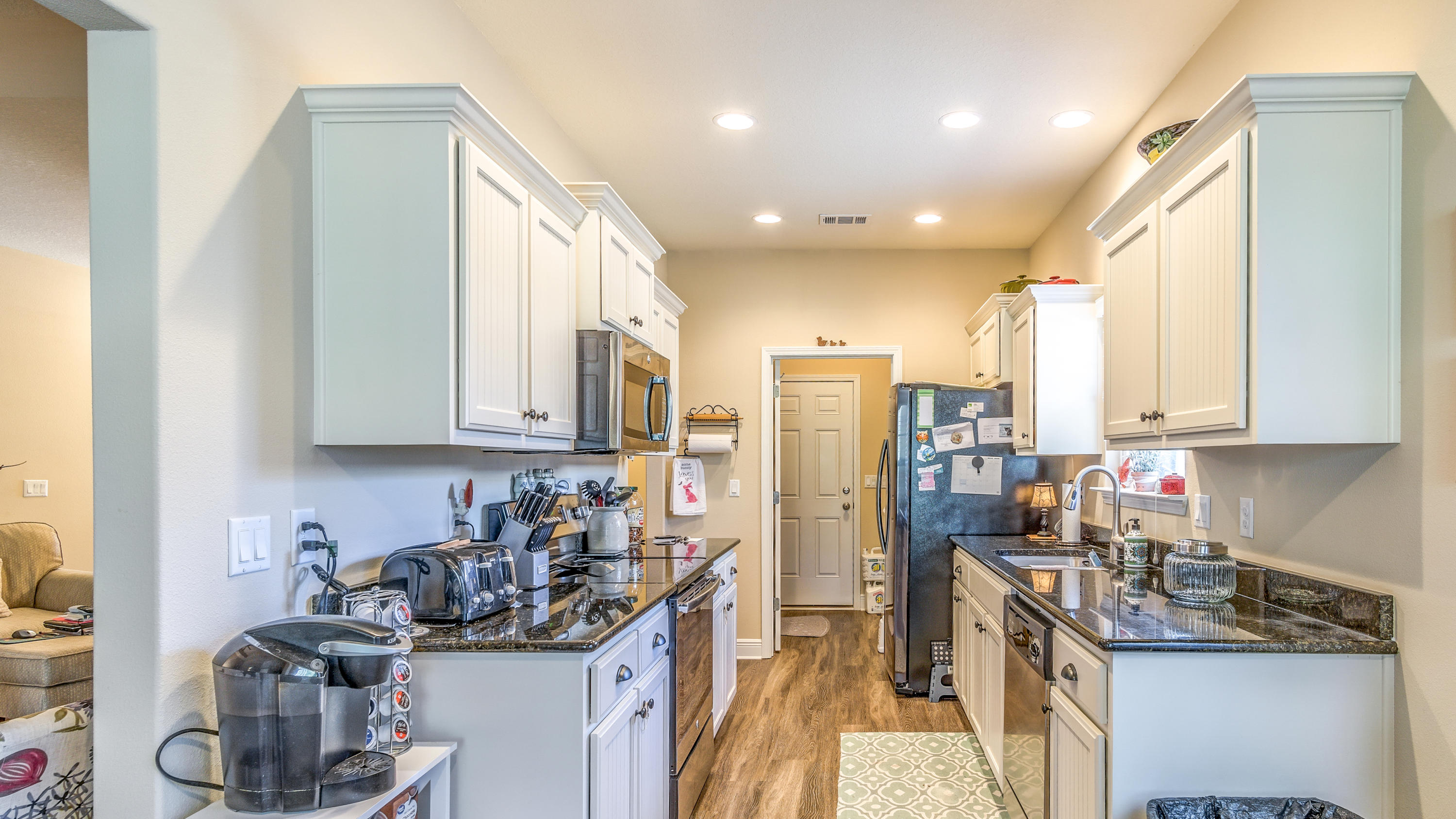 12 Benton Boulevard Freeport, FL 32439 - Photo 7 of 28 a kitchen with stainless steel appliances granite countertop a sink stove and cabinets