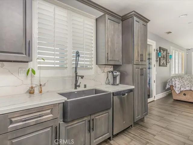 a kitchen with a sink and cabinets