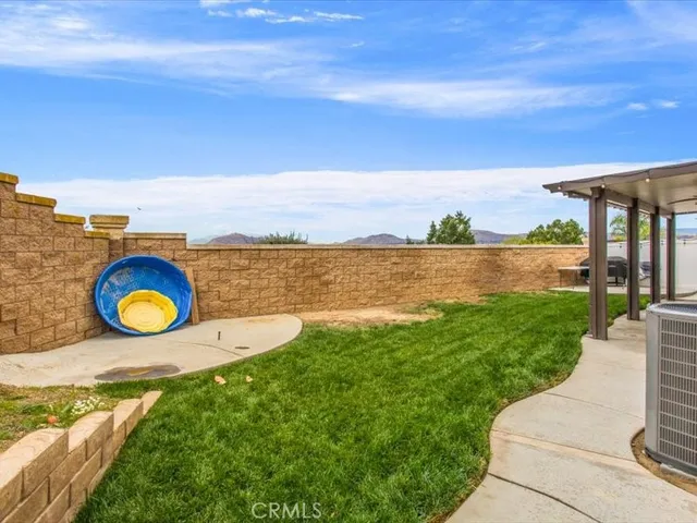 a view of a swimming pool with an outdoor seating
