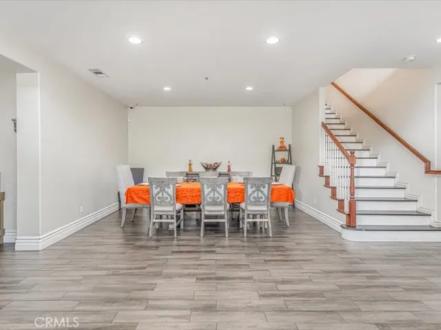 a group of people sitting on floor in a room