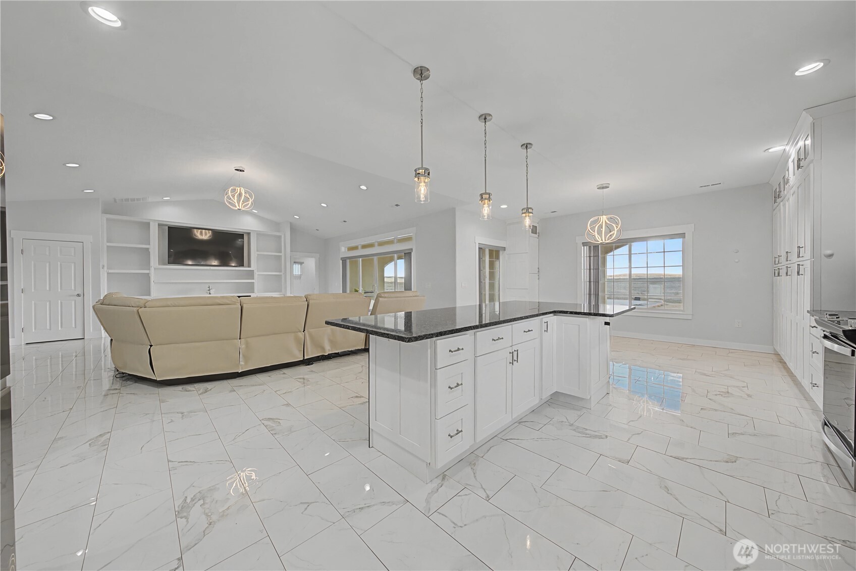 21347 Rd D.5 Soap Lake, WA 98851 - Photo 15 of 40 a large white kitchen with kitchen island granite countertop lots of white cabinets