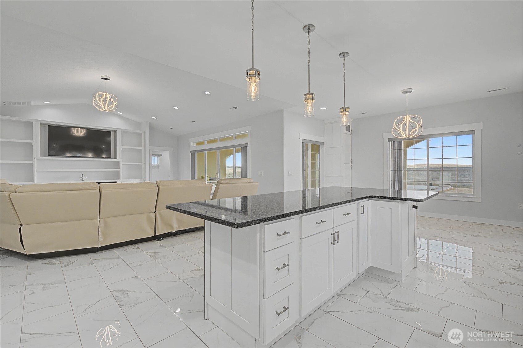 21347 Rd D.5 Soap Lake, WA 98851 - Photo 17 of 40 a kitchen with granite countertop a sink and white cabinets