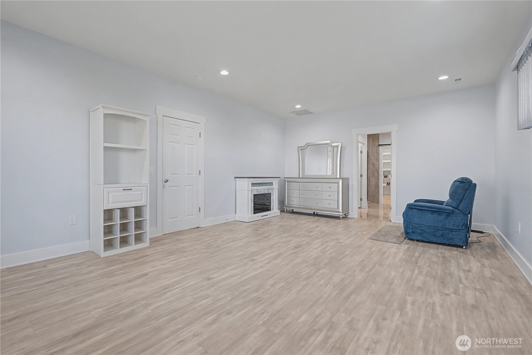 21347 Rd D.5 Soap Lake, WA 98851 - Photo 19 of 40 a view of empty room with wooden floor and kitchen