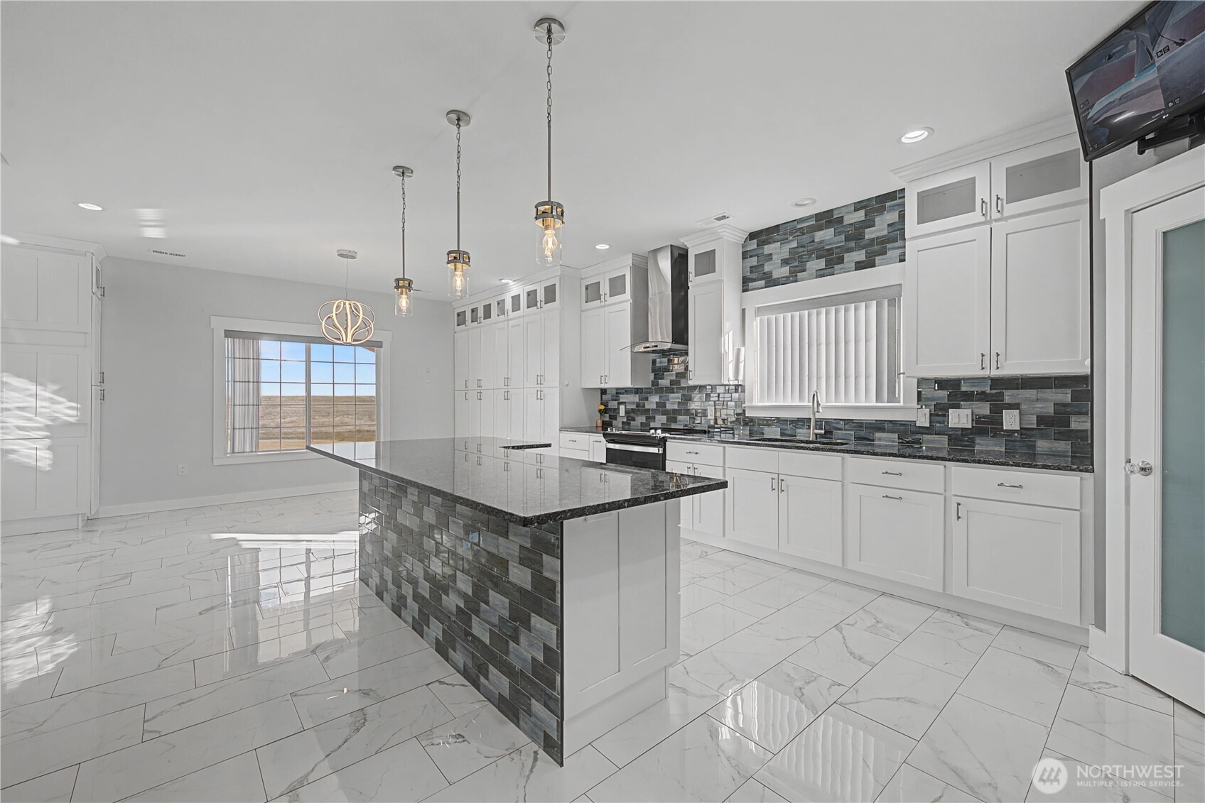 21347 Rd D.5 Soap Lake, WA 98851 - Photo 3 of 40 a kitchen with stainless steel appliances kitchen island granite countertop a sink and cabinets