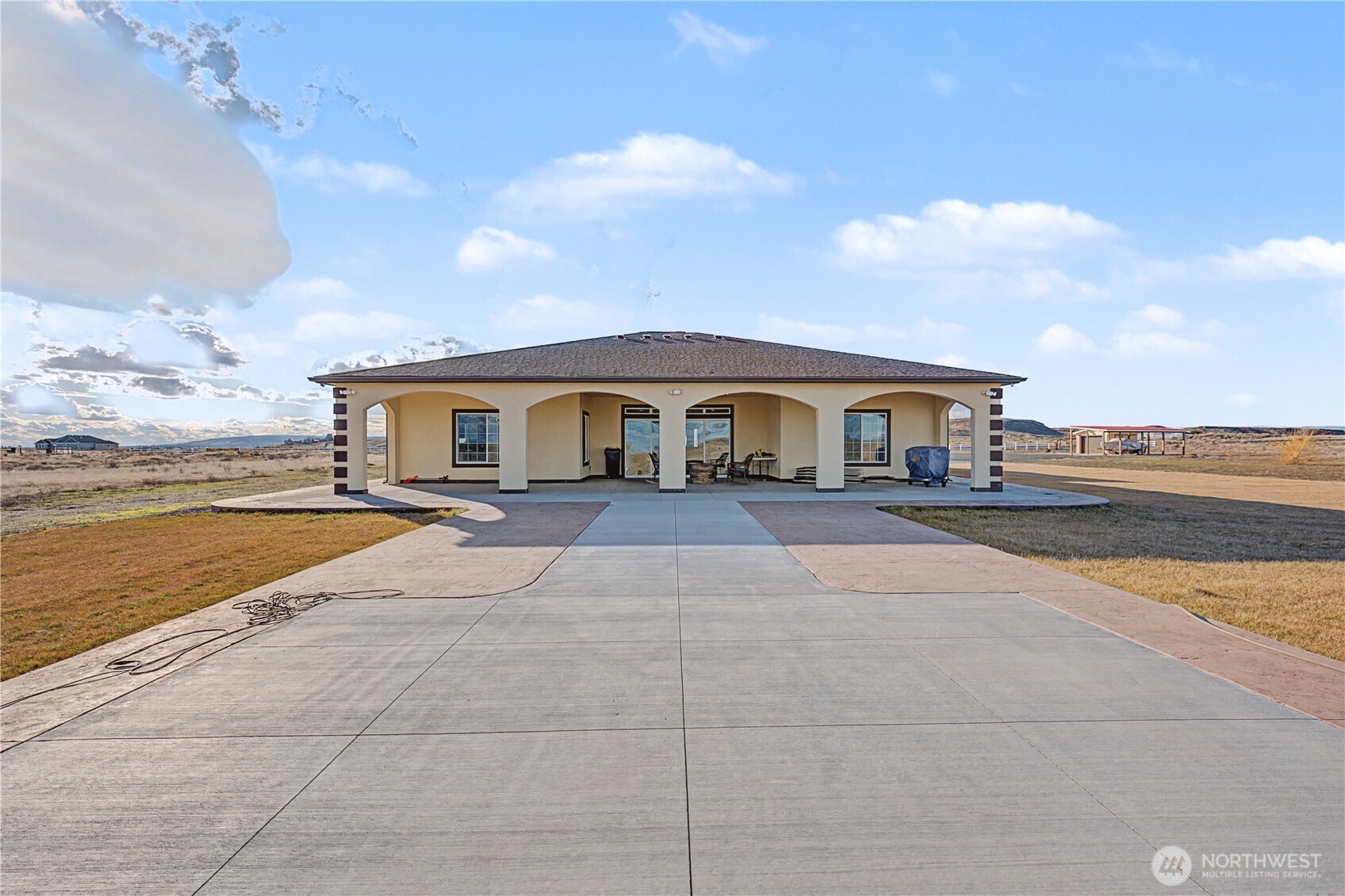 21347 Rd D.5 Soap Lake, WA 98851 - Photo 33 of 40 a house with swimming pool in front of it