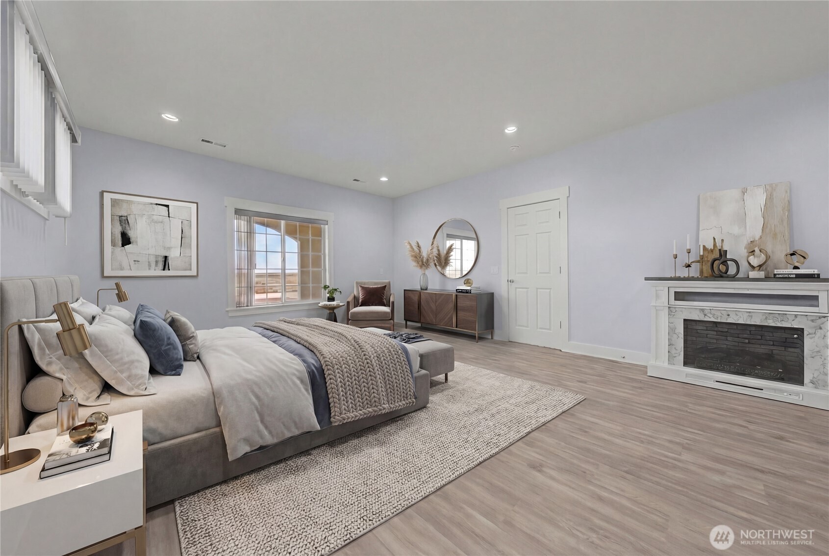 21347 Rd D.5 Soap Lake, WA 98851 - Photo 38 of 40 a spacious bedroom with a large bed and a fireplace