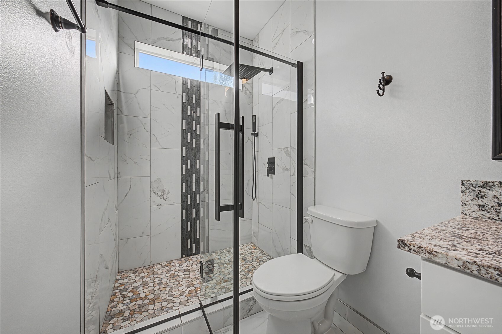 21347 Rd D.5 Soap Lake, WA 98851 - Photo 10 of 40 a bathroom with a granite countertop toilet a sink and shower