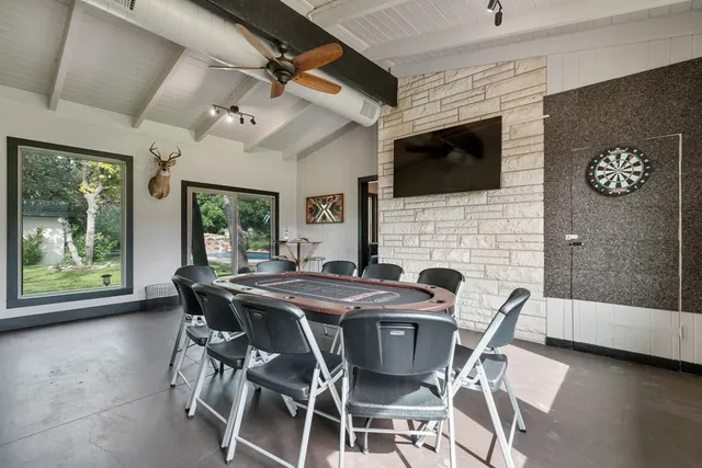 a view of a dining room with furniture and a fireplace