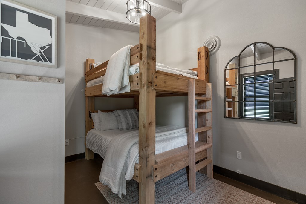 48 Kneese Road Fredericksburg, TX 78624 - Photo 17 of 43 a bedroom with a bed and a window