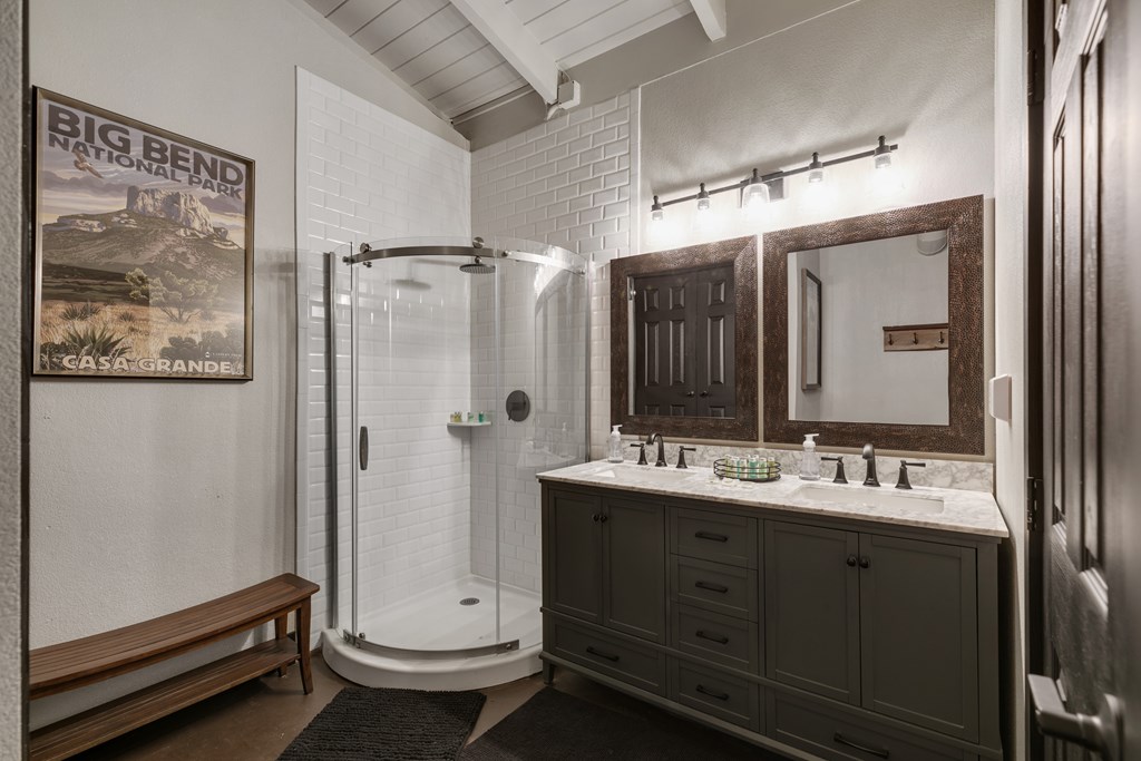 48 Kneese Road Fredericksburg, TX 78624 - Photo 18 of 43 a bathroom with a double vanity sink toilet and shower