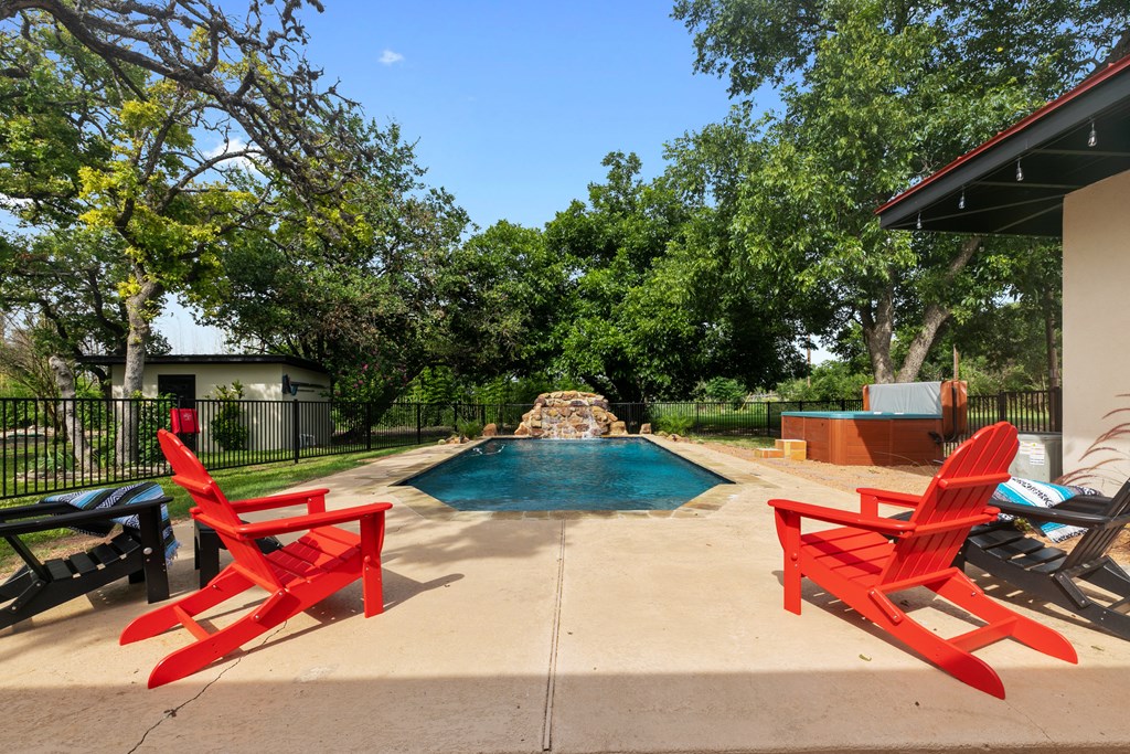 48 Kneese Road Fredericksburg, TX 78624 - Photo 21 of 43 a view of backyard with swimming pool and sitting area