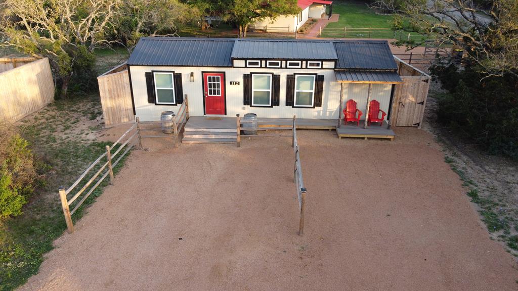 48 Kneese Road Fredericksburg, TX 78624 - Photo 27 of 43 a view of a house with porch and chairs