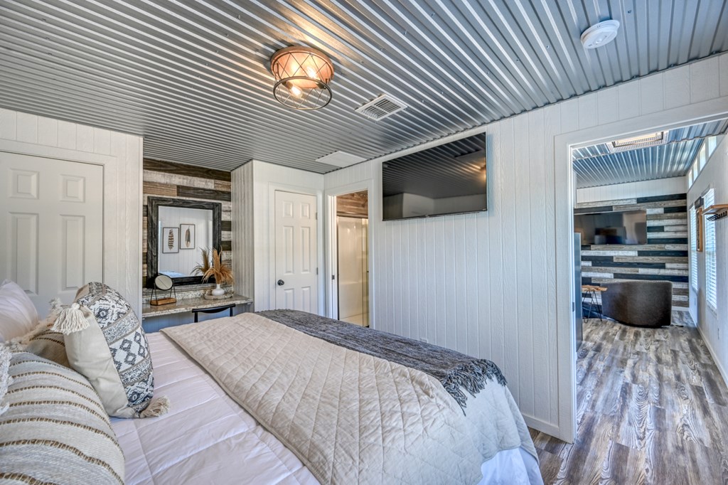 48 Kneese Road Fredericksburg, TX 78624 - Photo 28 of 43 a bedroom with a bed and a television