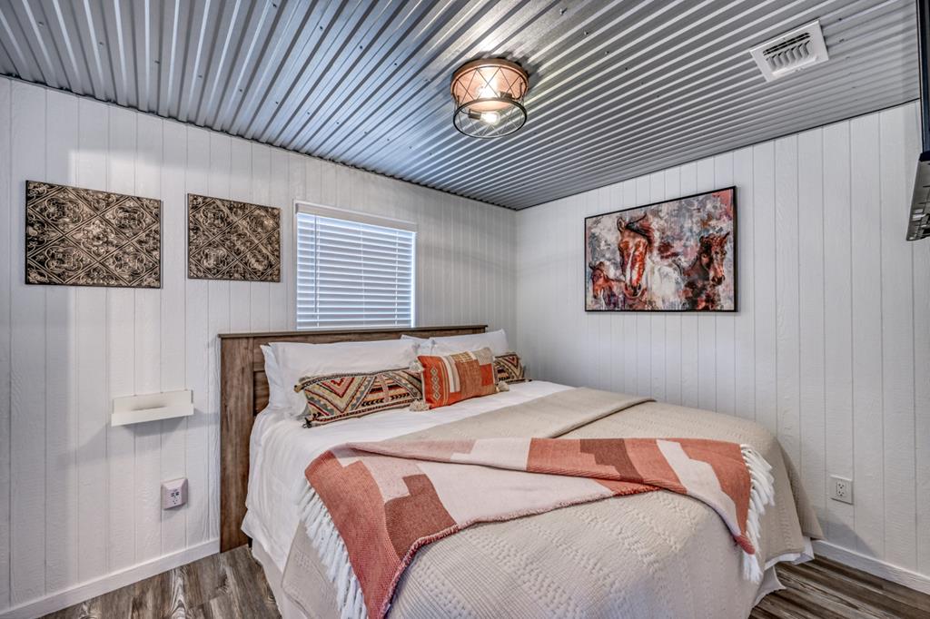 48 Kneese Road Fredericksburg, TX 78624 - Photo 36 of 43 a bedroom with bed and a window