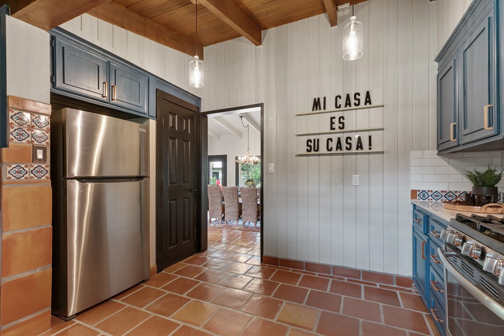 48 Kneese Road Fredericksburg, TX 78624 - Photo 9 of 43 a kitchen with stainless steel appliances granite countertop a refrigerator a stove and a sink