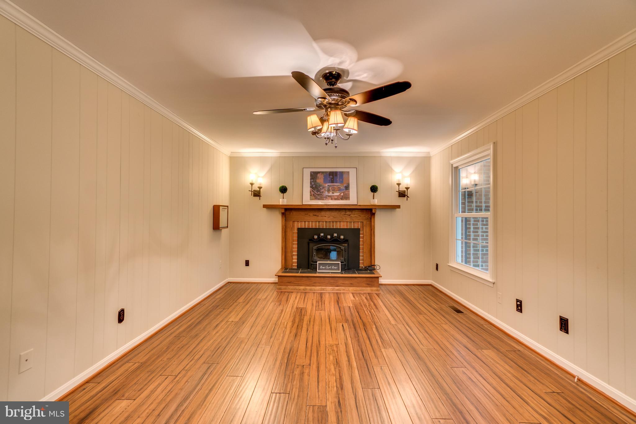 117 Bluff Point Road Fredericksburg, VA 22407 - Photo 18 of 30 a view of an empty room with a fireplace and a window