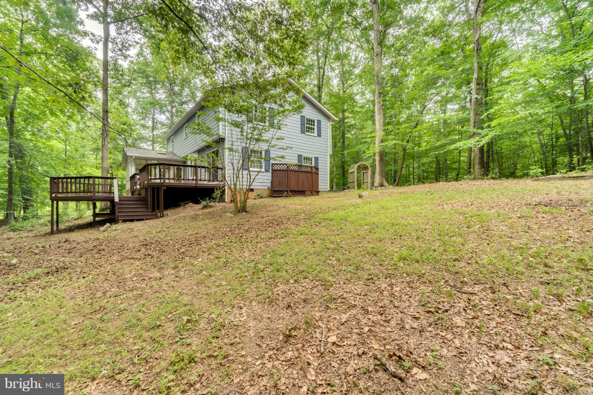 117 Bluff Point Road Fredericksburg, VA 22407 - Photo 4 of 30 a house with trees in front of it