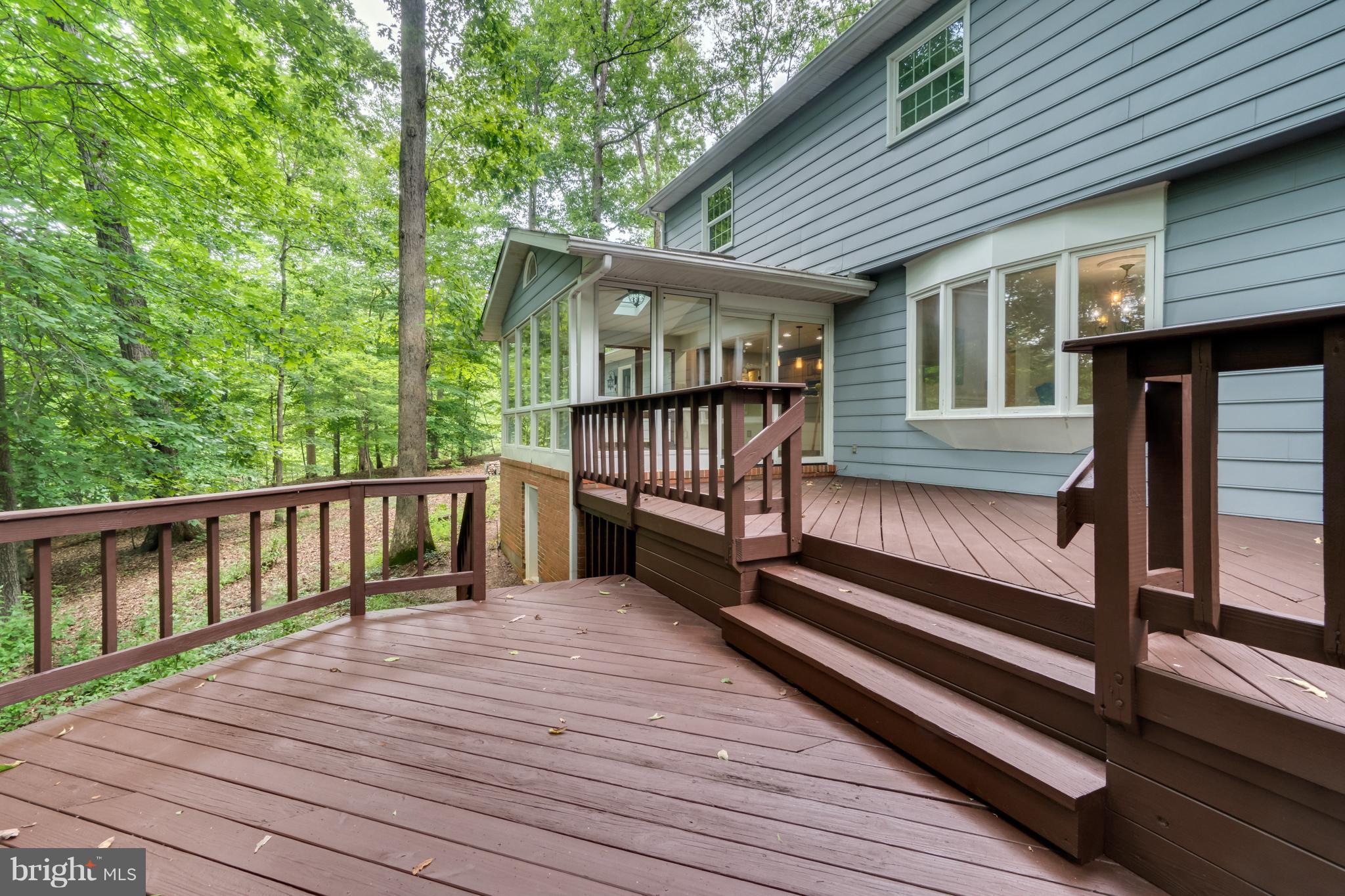 117 Bluff Point Road Fredericksburg, VA 22407 - Photo 5 of 30 a view of deck with two chairs and wooden floor