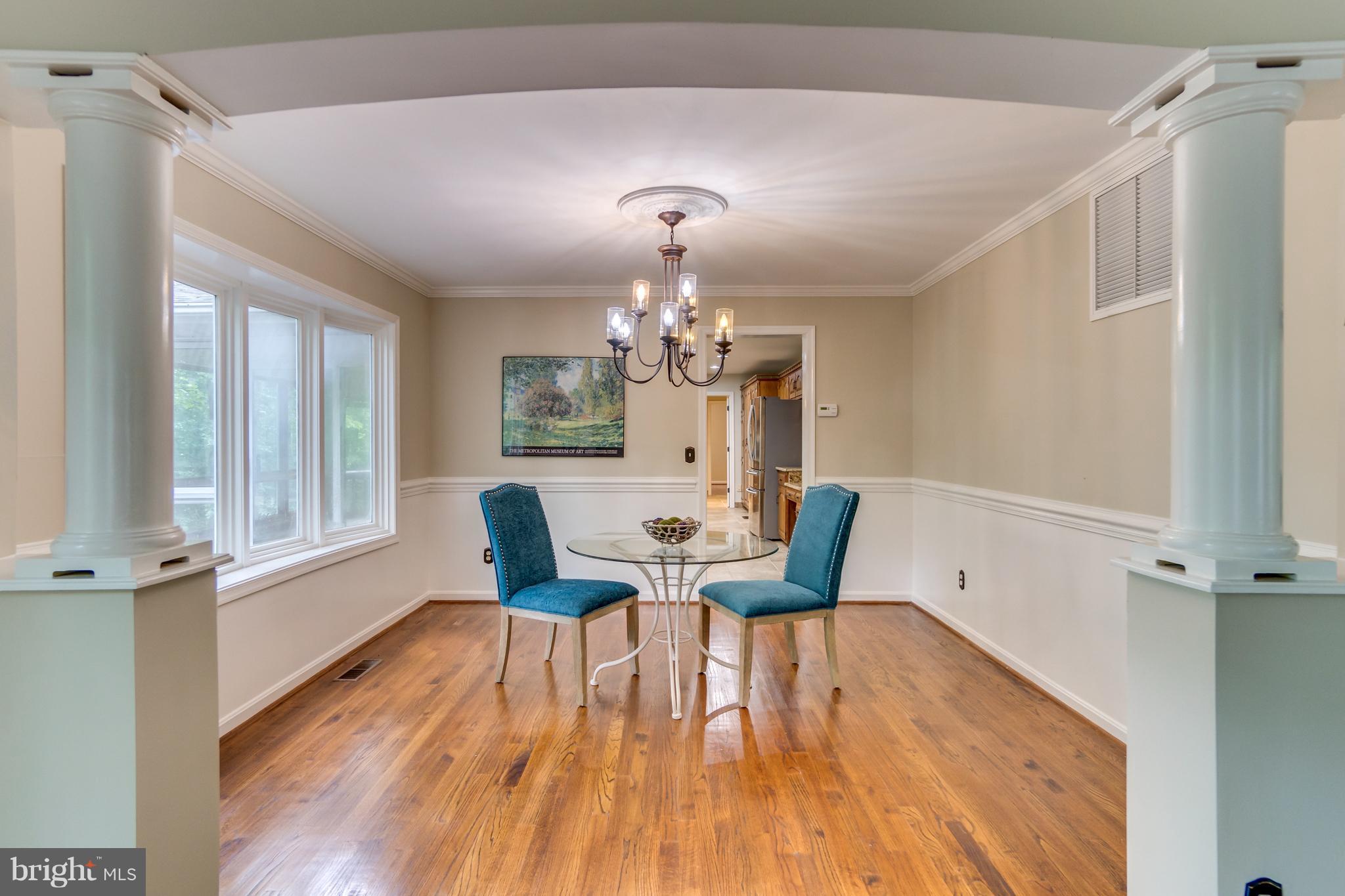 117 Bluff Point Road Fredericksburg, VA 22407 - Photo 9 of 30 a view of a dining room with furniture a chandelier and wooden floor