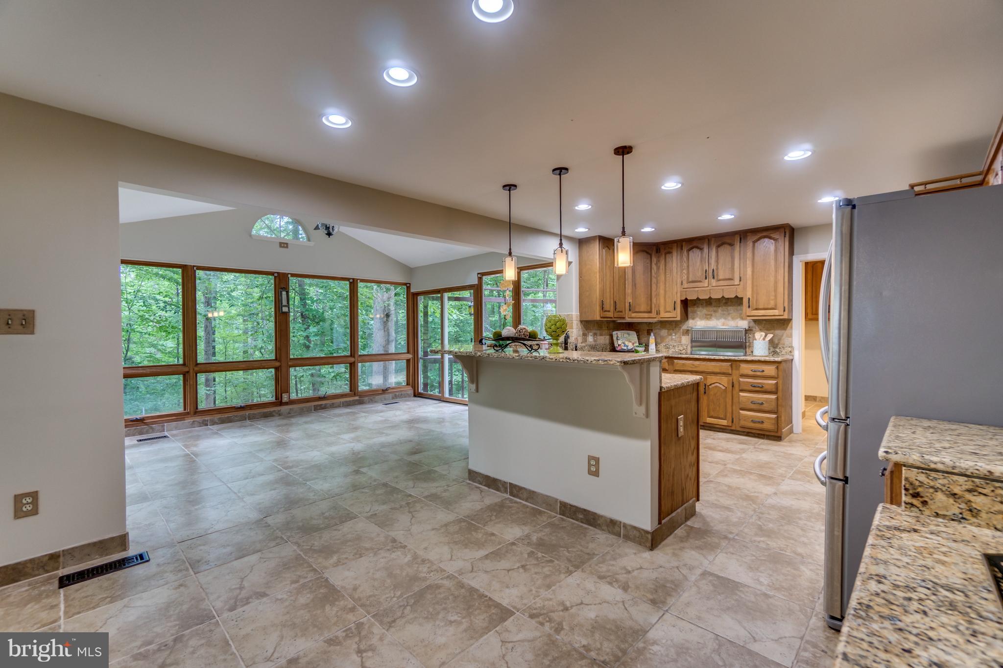 117 Bluff Point Road Fredericksburg, VA 22407 - Photo 10 of 30 a view of a kitchen with furniture and refrigerator