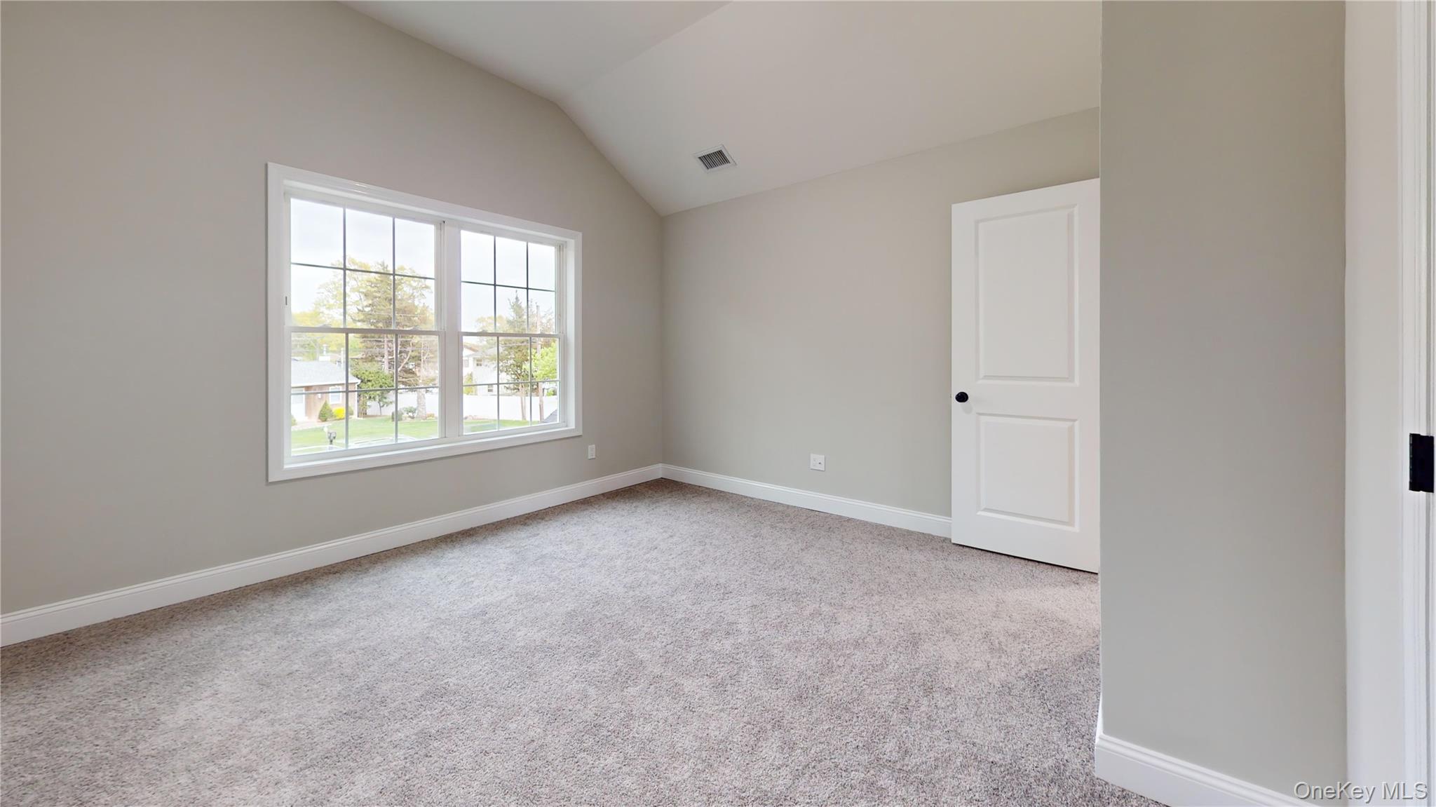 492 Blue Point Road Farmingville, NY 11738 - Photo 17 of 21 an empty room with a window