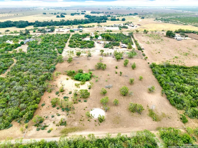 an aerial view of beach and residential space