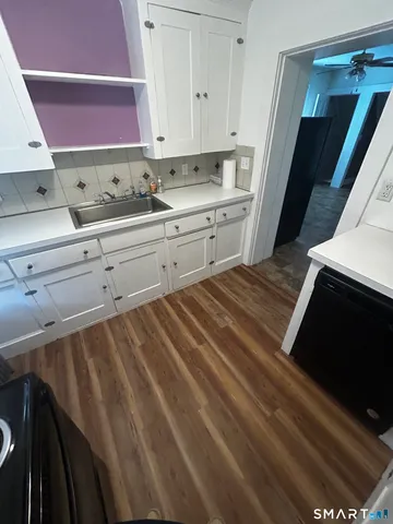 a kitchen with a sink and cabinets