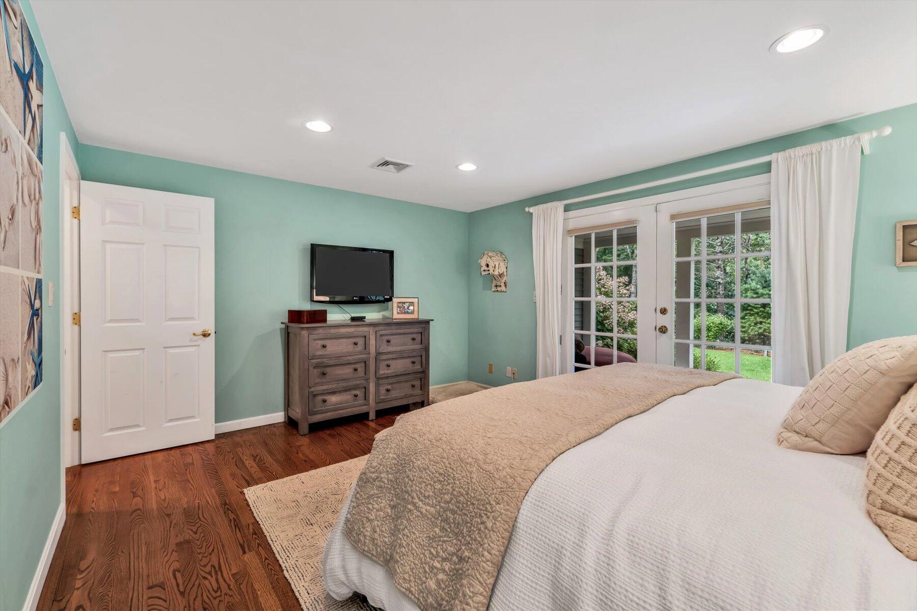 41 Summersea Road Mashpee, MA 02649 - Photo 21 of 39 a spacious bedroom with a bed and flat screen tv