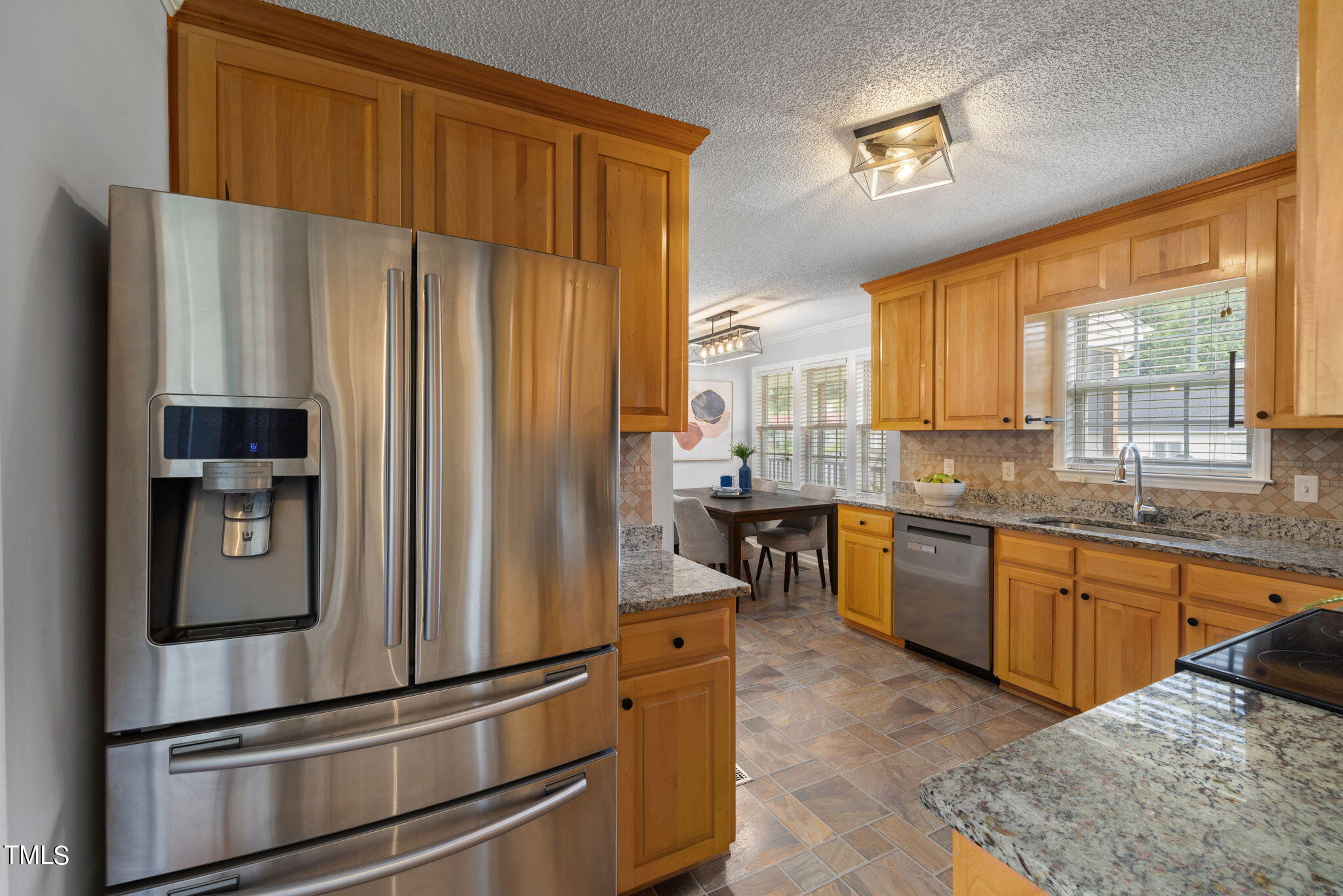 1500 Harvey Johnson Road Raleigh, NC 27603 - Photo 11 of 42 a kitchen with stainless steel appliances granite countertop a refrigerator and a sink