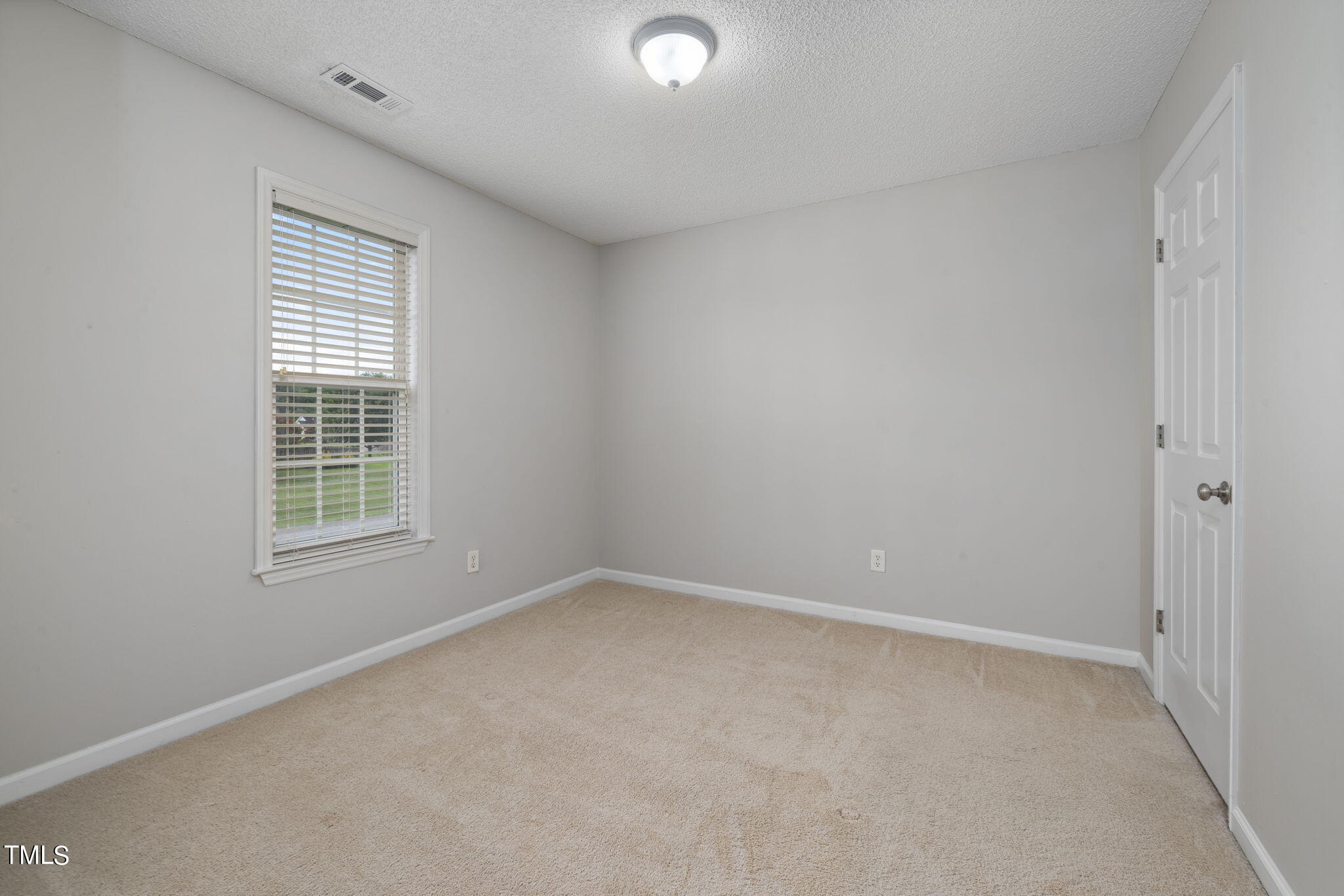 1500 Harvey Johnson Road Raleigh, NC 27603 - Photo 23 of 42 a view of an empty room with a window