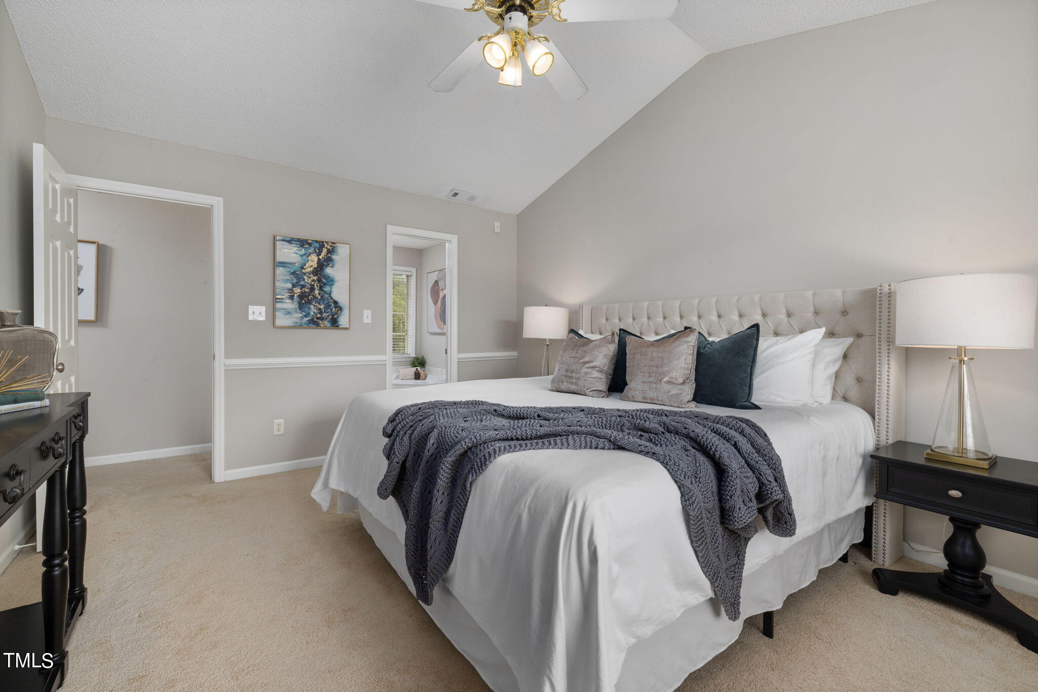 1500 Harvey Johnson Road Raleigh, NC 27603 - Photo 27 of 42 a spacious bedroom with a bed and a chandelier