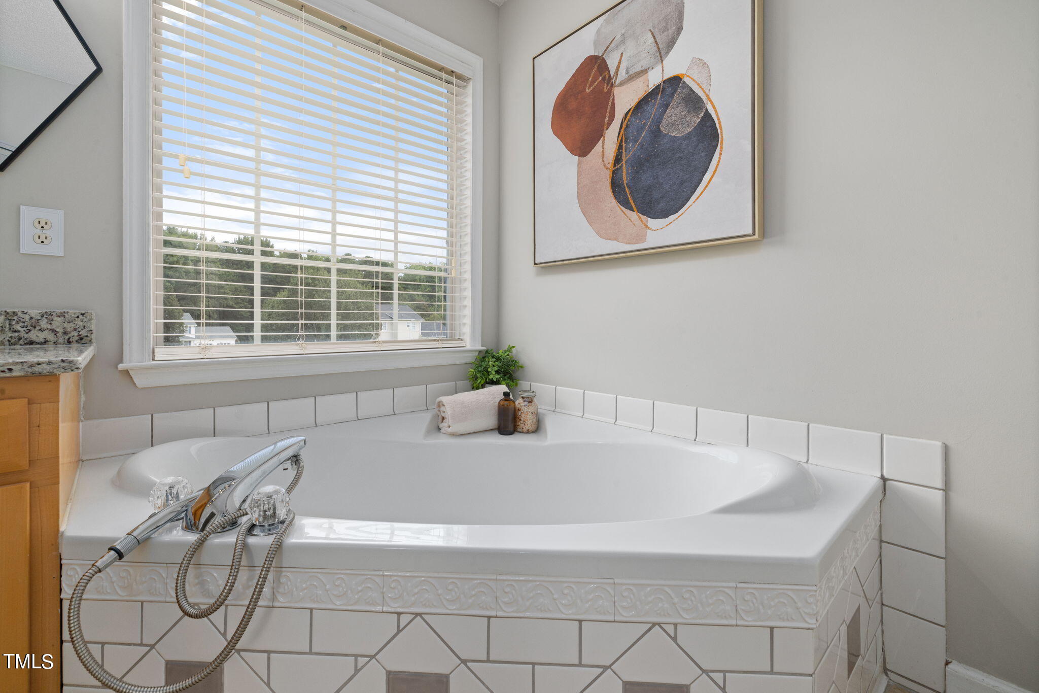 1500 Harvey Johnson Road Raleigh, NC 27603 - Photo 32 of 42 a white bath tub sitting next to a window