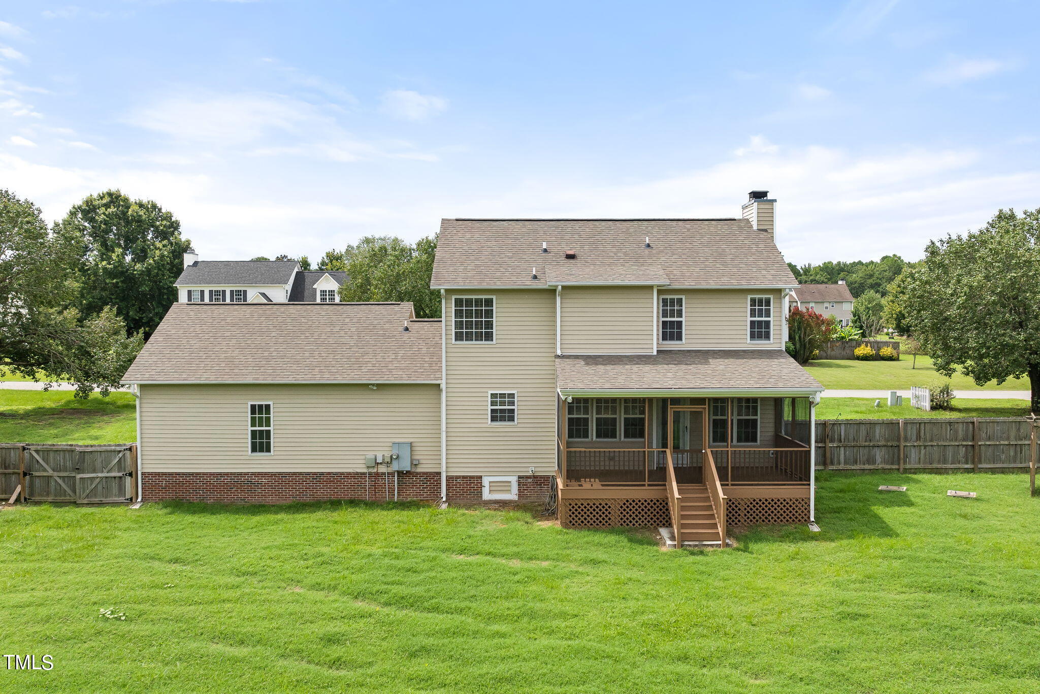 1500 Harvey Johnson Road Raleigh, NC 27603 - Photo 38 of 42 a aerial view of a house with a yard table and chairs