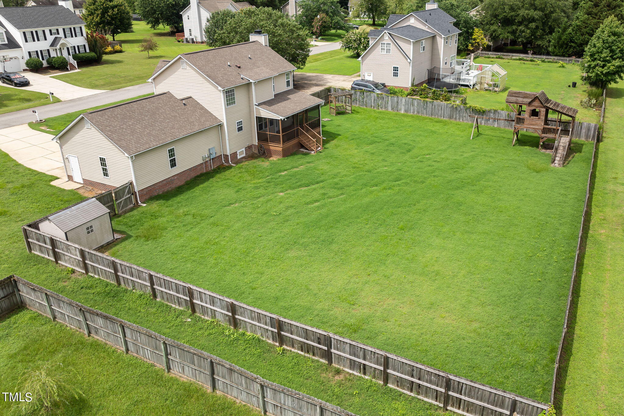 1500 Harvey Johnson Road Raleigh, NC 27603 - Photo 39 of 42 a view of house with backyard and outdoor seating