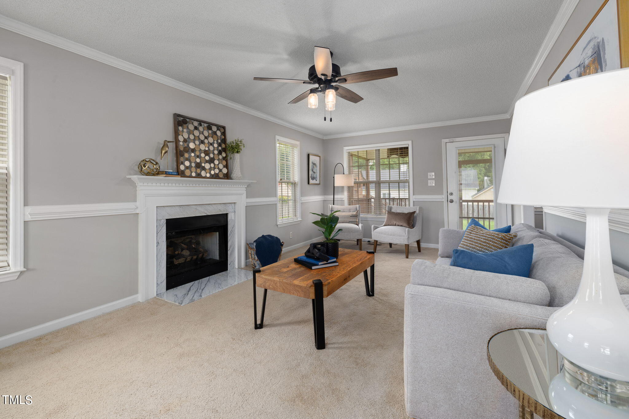 1500 Harvey Johnson Road Raleigh, NC 27603 - Photo 4 of 42 a living room with furniture and a fireplace