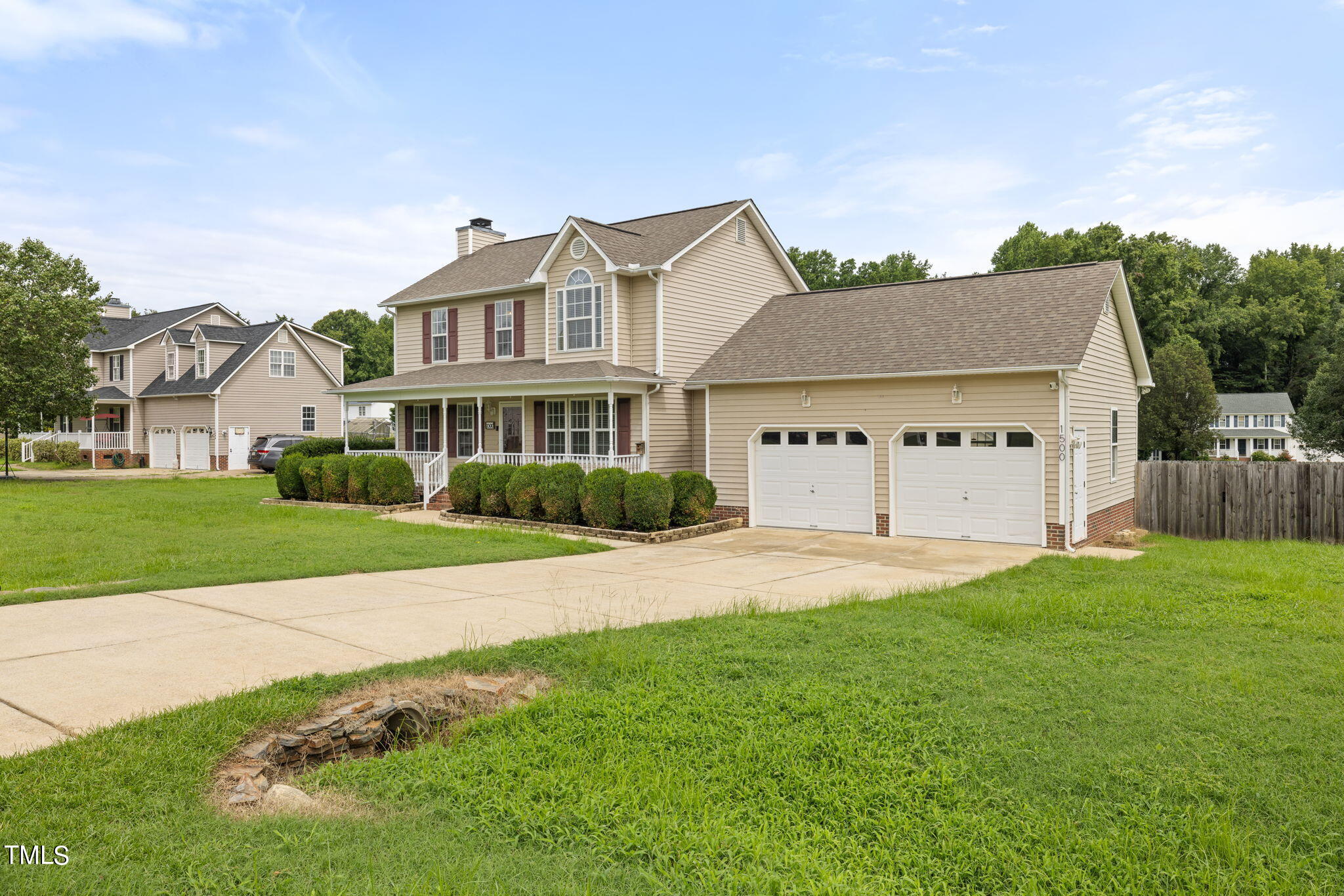 1500 Harvey Johnson Road Raleigh, NC 27603 - Photo 42 of 42 a view of a white house with a big yard and large trees