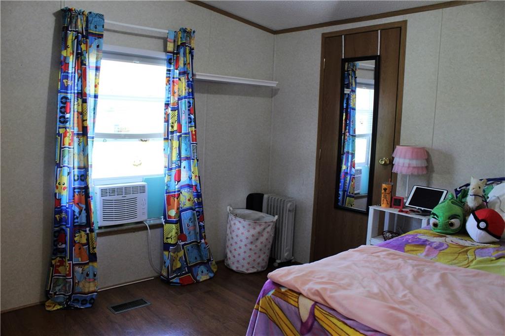 349 Country Lane Road Prospect, PA 16052 - Photo 12 of 25 a bedroom with bed and a wooden floor