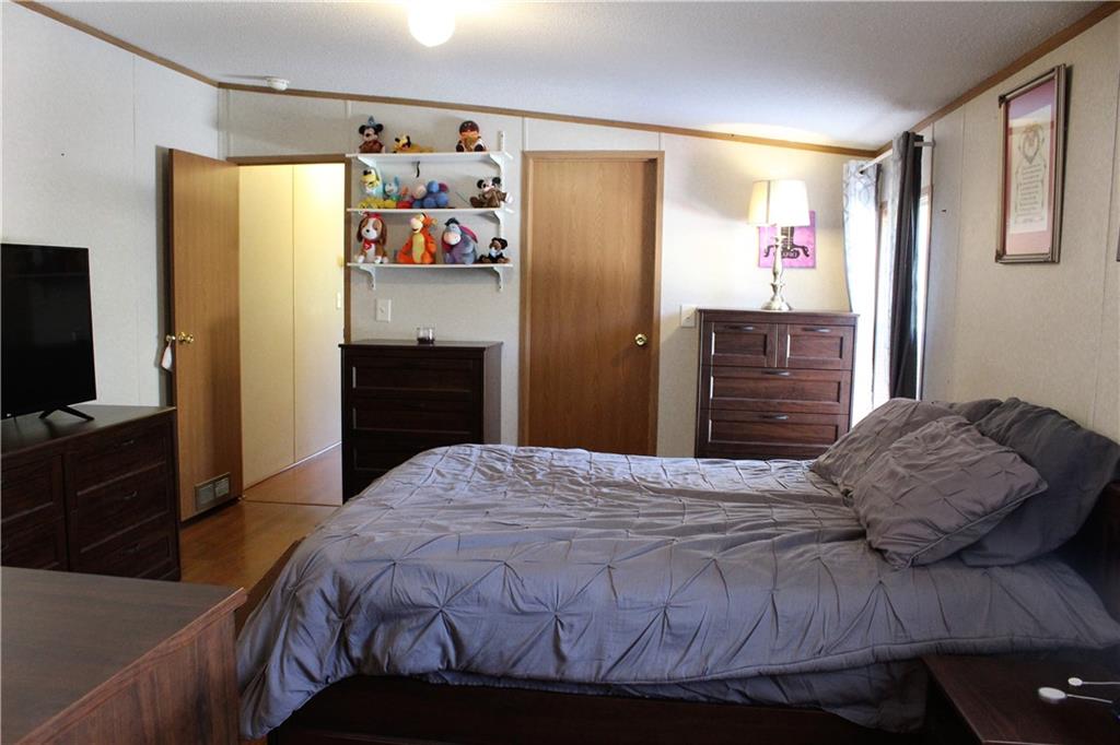 349 Country Lane Road Prospect, PA 16052 - Photo 14 of 25 a bedroom with a bed and a flat screen tv
