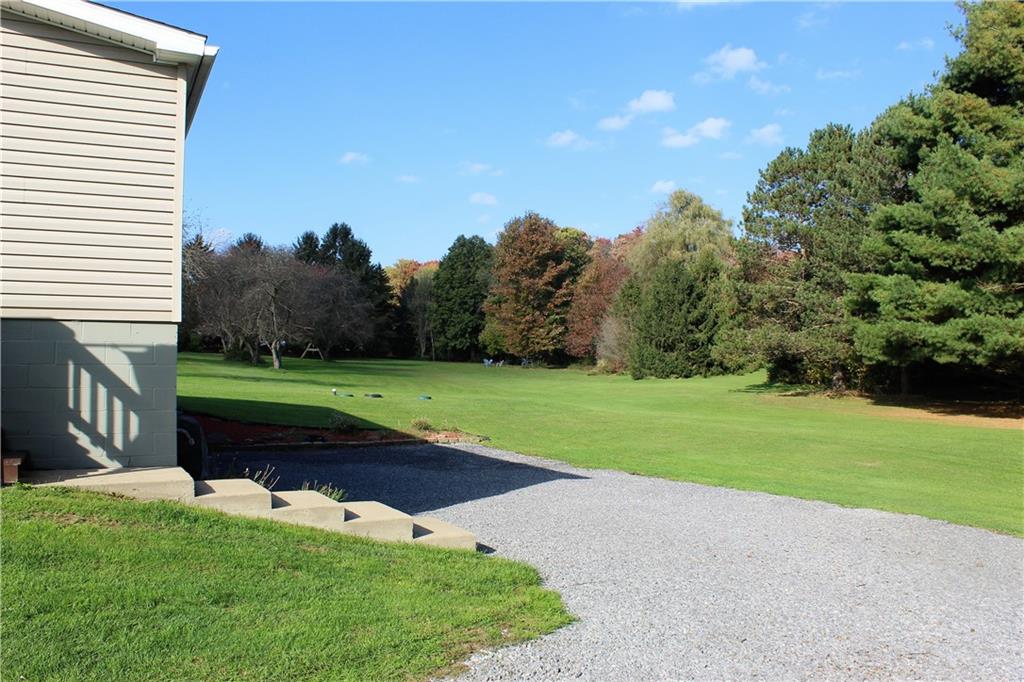 349 Country Lane Road Prospect, PA 16052 - Photo 21 of 25 a view of a field with of a house in the background
