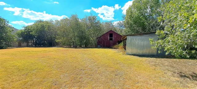 a view of swimming pool with a yard