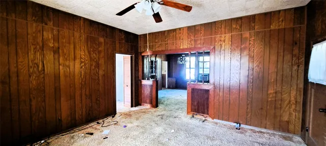 a view of a hallway with wooden shelves