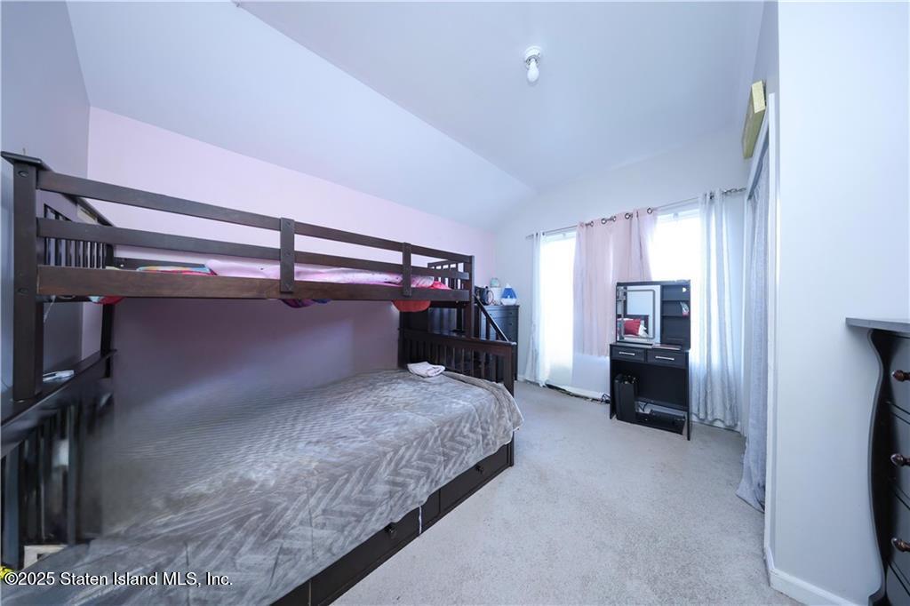 20 Buel Avenue, Unit A Staten Island, NY 10304 - Photo 14 of 30 a bedroom with a bed and a desk
